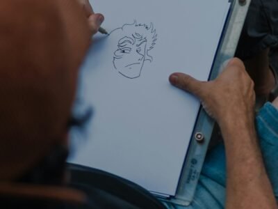Artist sketching a cartoon face by hand