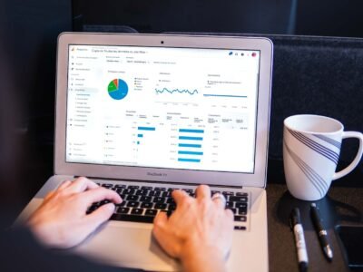 Reviewing paid campaign spend on a laptop