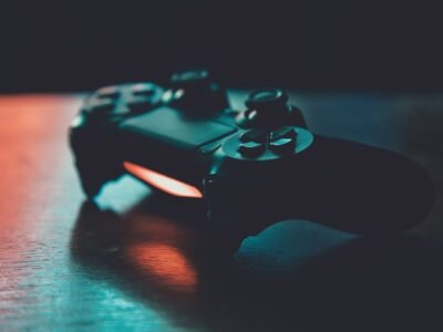 Game controller lit in blue and orange
